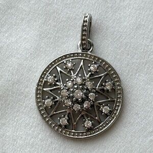 Elegant Silver Starburst Pendant